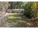 Exterior view of a well-maintained home, featuring a spacious yard and mature trees, creating a serene setting at 1141 Goodwin Ne Pl, Brookhaven, GA 30319