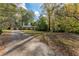A long driveway leads to a well-maintained home with a large front yard, showcasing curb appeal and space at 1141 Goodwin Ne Pl, Brookhaven, GA 30319