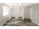 Bright bedroom with double closets and wood-look flooring at 3130 Mars Hill Rd, Acworth, GA 30101