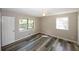 Spacious bedroom with wood-look floors and large window at 3130 Mars Hill Rd, Acworth, GA 30101