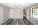 Spacious bedroom with ceiling fan and wood-look flooring at 3130 Mars Hill Rd, Acworth, GA 30101