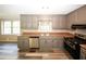 Kitchen with gray cabinets and stainless appliances at 3130 Mars Hill Rd, Acworth, GA 30101