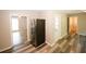 Kitchen with stainless steel refrigerator and wood-look floors at 3130 Mars Hill Rd, Acworth, GA 30101