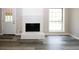 Living room with fireplace and wood-look floors at 3130 Mars Hill Rd, Acworth, GA 30101