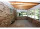 Screened sunroom with brick walls and concrete floor at 3130 Mars Hill Rd, Acworth, GA 30101