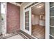 Balcony with brick siding offers outdoor living space accessible from inside at 1965 Nocturne Dr # 1209, Alpharetta, GA 30009
