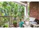 Charming balcony with a brick facade, stylish decor, and an inviting outdoor ambiance at 1965 Nocturne Dr # 1209, Alpharetta, GA 30009