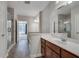 Bathroom boasting a single sink vanity, glass shower, and wood-look floors at 1965 Nocturne Dr # 1209, Alpharetta, GA 30009