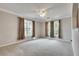 Spacious bedroom with soft carpet, a ceiling fan, and plenty of natural light at 1965 Nocturne Dr # 1209, Alpharetta, GA 30009