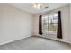 Bedroom featuring carpeting, a ceiling fan, window, and a neutral color scheme at 1965 Nocturne Dr # 1209, Alpharetta, GA 30009