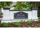 An image of the Westside Commons Condominiums community sign in front of green landscaping at 1965 Nocturne Dr # 1209, Alpharetta, GA 30009