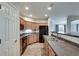 Open-concept kitchen with stainless steel appliances and wood cabinets at 1965 Nocturne Dr # 1209, Alpharetta, GA 30009