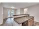 Bright kitchen featuring stainless steel appliances, wood cabinets and breakfast bar that opens to the living room at 1965 Nocturne Dr # 1209, Alpharetta, GA 30009