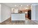 Open-concept kitchen with stainless steel appliances and wood cabinets at 1965 Nocturne Dr # 1209, Alpharetta, GA 30009