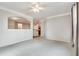 Bright living room with soft carpet and view to the kitchen at 1965 Nocturne Dr # 1209, Alpharetta, GA 30009