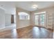 Bright living area with wood floors, neutral paint, and access to a balcony at 1965 Nocturne Dr # 1209, Alpharetta, GA 30009