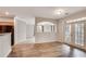 Bright living room with hardwood flooring and access to the balcony at 1965 Nocturne Dr # 1209, Alpharetta, GA 30009