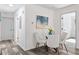 Bright dining area with a glass table and four light gray chairs at 2038 Rosewood Rd, Decatur, GA 30032