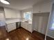 Bright kitchen featuring new white cabinets, stainless steel appliances, quartz countertop, and a stainless steel sink at 101 Mountain Brook Dr, Cumming, GA 30040