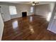 Bright living room featuring hardwood floors and a fireplace at 101 Mountain Brook Dr, Cumming, GA 30040