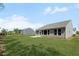 Exterior of home boasts a manicured lawn, patio, and a view of the neighboring property at 106 Cherry Glen Way, Euharlee, GA 30145