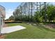 Exterior view of the back of the home showcasing a manicured lawn and patio area at 106 Cherry Glen Way, Euharlee, GA 30145