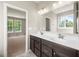 Bathroom with a dual sink vanity and modern fixtures, next to the bedroom at 106 Cherry Glen Way, Euharlee, GA 30145