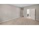 Spacious bedroom featuring neutral tones, soft carpet, and an ensuite bathroom for added convenience at 106 Cherry Glen Way, Euharlee, GA 30145