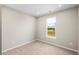 Cozy bedroom boasts natural light from three windows, neutral carpet and walls, and recessed lighting at 106 Cherry Glen Way, Euharlee, GA 30145