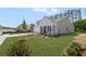 Side view of a gray single-story home with a well-kept lawn and a light-colored driveway at 106 Cherry Glen Way, Euharlee, GA 30145
