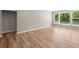 Spacious living area featuring hardwood floors, natural light, and neutral walls, perfect for relaxation at 106 Cherry Glen Way, Euharlee, GA 30145