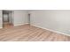 Neutral living area with hardwood floors, leading to the front door, and minimalist design at 106 Cherry Glen Way, Euharlee, GA 30145