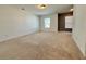 Large carpeted bedroom with two windows and neutral walls at 1395 Ben Park Way, Grayson, GA 30017