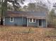 Gray house with a yard, trees, and leaf covered roof at 3028 Grand Sw Ave, Atlanta, GA 30315