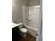 Bathroom with tub/shower combo and dark vanity at 4035 Cavalier Way, Duluth, GA 30097