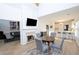 Open concept dining area with hardwood floors and fireplace at 545 Montrose Ln, Sandy Springs, GA 30328