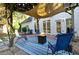 Outdoor patio area with fire pit and seating under pergola at 545 Montrose Ln, Sandy Springs, GA 30328