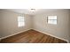 Bright bedroom featuring wood-look vinyl flooring at 500 Carillon Ct, Stone Mountain, GA 30083