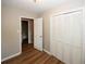 Spacious bedroom with large closet and wood-look flooring at 500 Carillon Ct, Stone Mountain, GA 30083