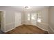 Bright dining area with wood-look flooring and exterior access at 500 Carillon Ct, Stone Mountain, GA 30083