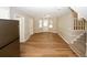 Bright dining area with hardwood floors and access to kitchen at 500 Carillon Ct, Stone Mountain, GA 30083