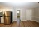 Hardwood floor dining room with kitchen and hallway access at 500 Carillon Ct, Stone Mountain, GA 30083