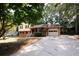 Ranch home with driveway, mature trees, and a well-maintained lawn at 500 Carillon Ct, Stone Mountain, GA 30083