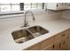 Modern kitchen sink with double basin and white quartz countertops at 500 Carillon Ct, Stone Mountain, GA 30083