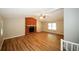 Spacious living area with brick fireplace and laminate flooring at 500 Carillon Ct, Stone Mountain, GA 30083