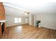 Large living room with hardwood floors and a brick fireplace at 500 Carillon Ct, Stone Mountain, GA 30083