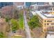 Aerial view of a community trail between buildings and city street featuring lush landscaping at 821 Ralph Mcgill Ne Blvd # 2303, Atlanta, GA 30306