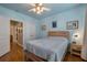 Bedroom featuring a bed, light hardwood floors, a closet and a ceiling fan at 821 Ralph Mcgill Ne Blvd # 2303, Atlanta, GA 30306