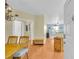 Open-concept dining area with wood floors, an elegant chandelier, and natural light streaming through an open doorway at 821 Ralph Mcgill Ne Blvd # 2303, Atlanta, GA 30306