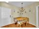 Cozy dining area featuring a built-in corner bench, wooden table, chandelier, and nautical-themed decor at 821 Ralph Mcgill Ne Blvd # 2303, Atlanta, GA 30306